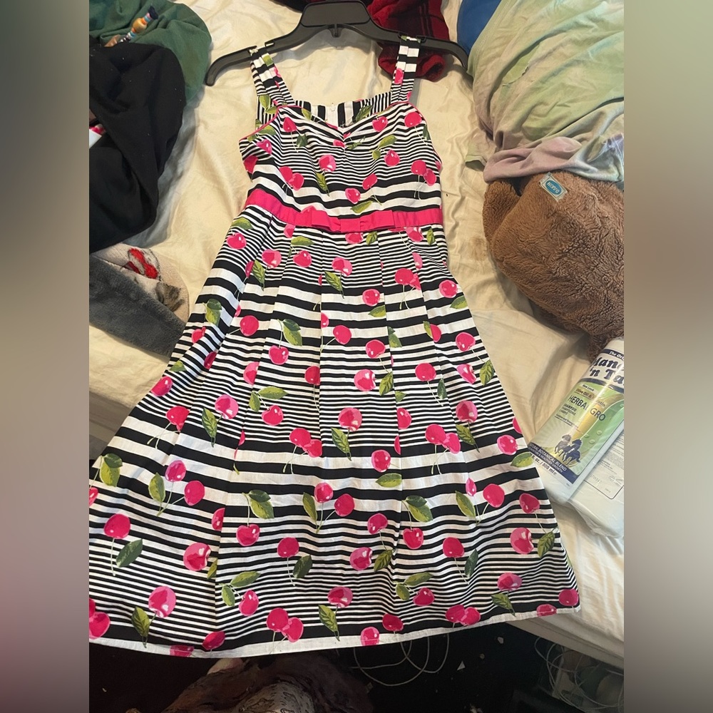 Children’s cherry dress. Size s/m. Has a zipper bag and hangs at the knees